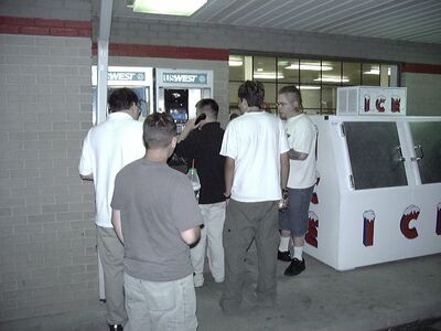 Calling numbers written on the payphone.