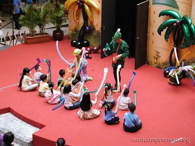 In the mall there is this "Balloon King" show.  This guy's face is everywhere in singapore.  Kinda creepy but kool I g