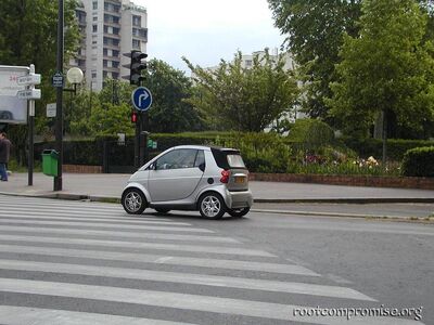 Smart Car.  Very Kool, too bad we can't have them in the States.