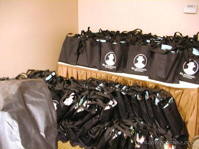 Piles of SWAG bags before registration.