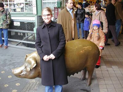 That kid is checkin' out the pigs ass.