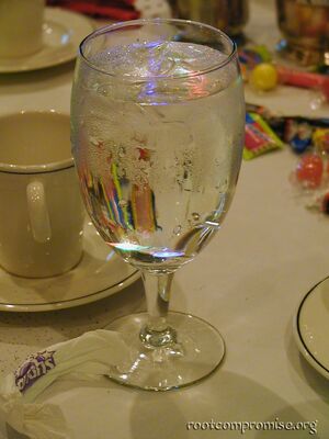 A flashing google pin in a glass of water.