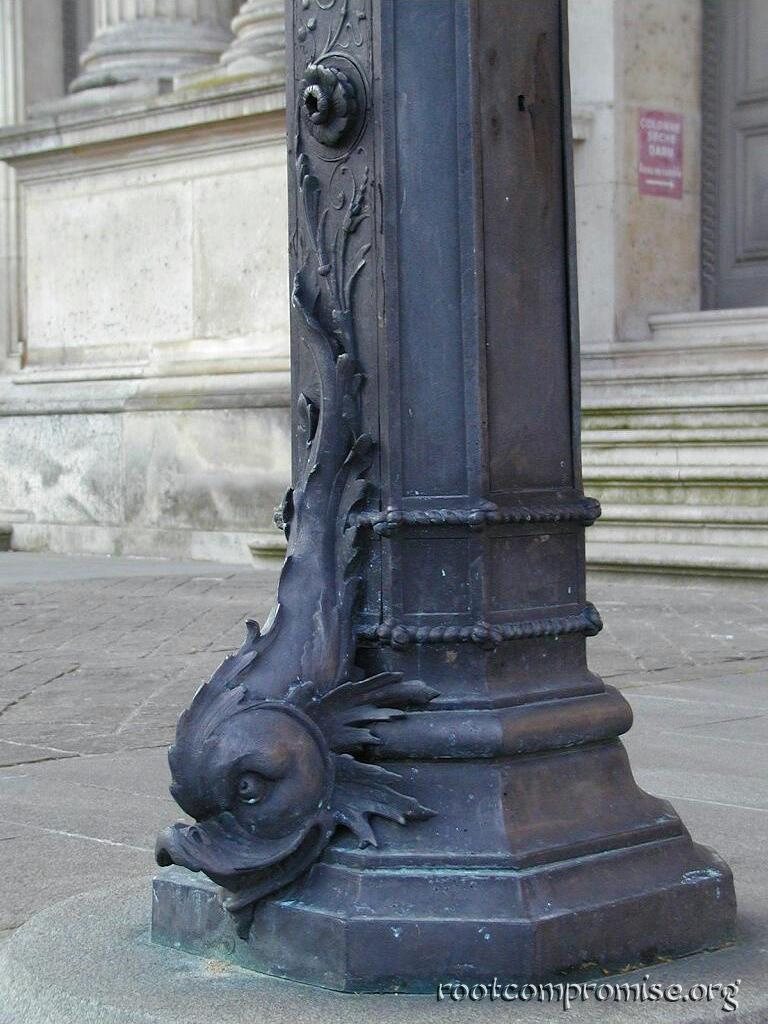 Weird fish thing on the bottom of all the Louvre lamp posts.
