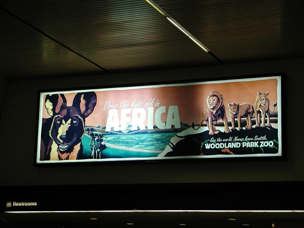 This was at the airport.  It's hard to see but it  says "Drop the kids off in Africa".  With Hyenas and Lions, I guess