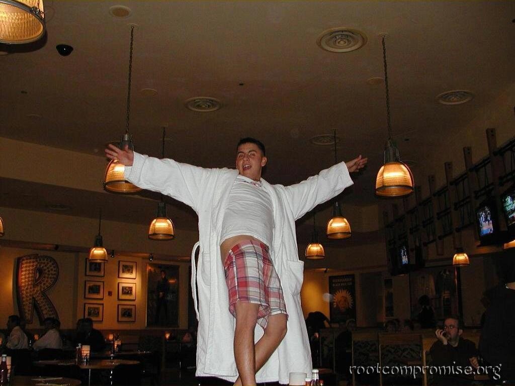 This guy jumped up on a table and started dancing when asked about his robe.