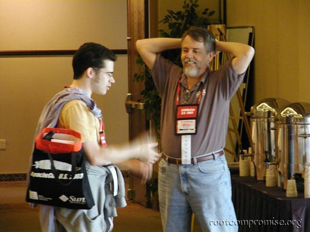 Chris Perillo speaking with other speakers.
